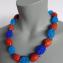 080 necklace red glass beads with blue oval shapes