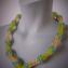 076 necklace light yellow/green with blue zig zag rings 