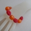 008a armband framboos met oranje harskralen